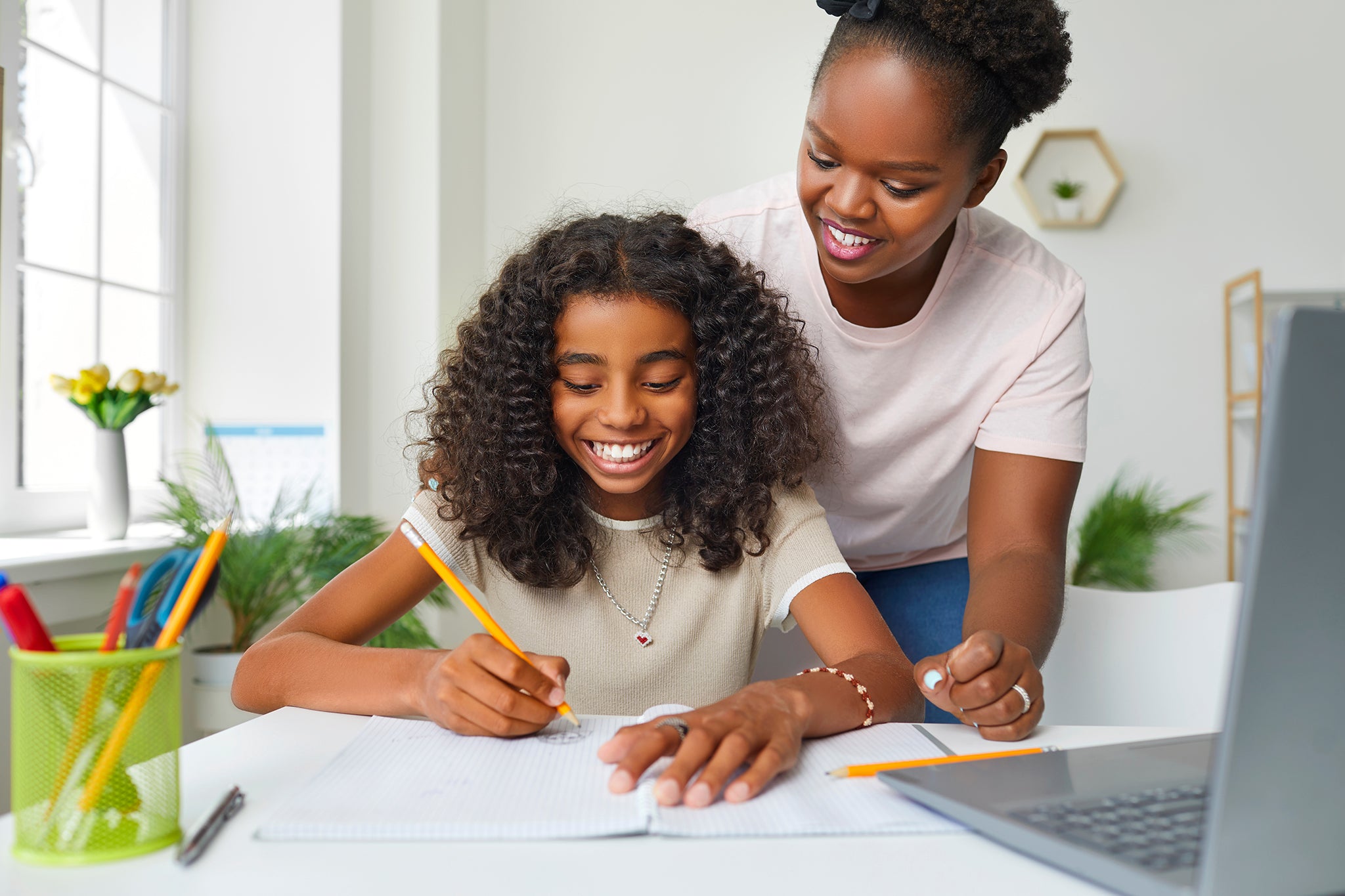 Mother and daughter working on homework together