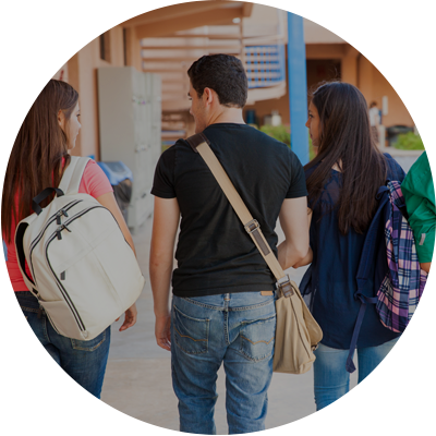 Group of students with backpacks walking together